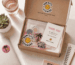 Small business unboxing experience featuring custom die-cut vinyl stickers and branded packaging